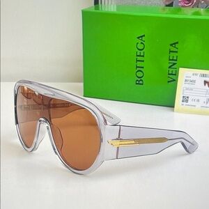 Bottega Veneta Clear Frame Sunglasses with Amber Lenses